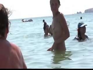 Watch these smooth nudists play at a public beach